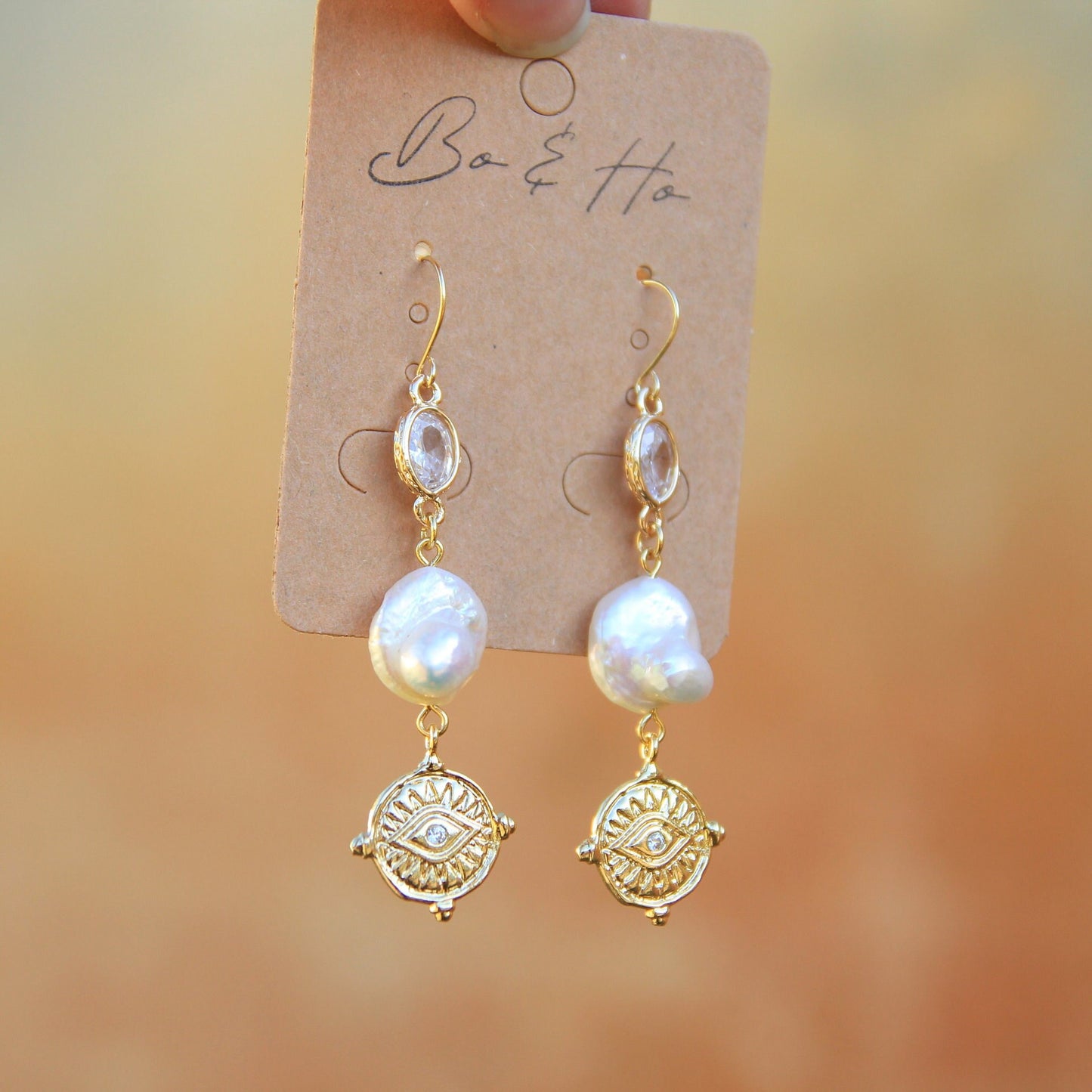 Gold Eye Coin Earrings with Large Freshwater Pearls